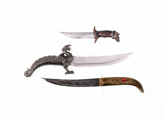 A collection of ancient oriental knives, vintage curved knives