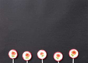 Lollipops sweets. Candy, top view flat lay on black background. Sweet sucker, lollipop, candy, food background