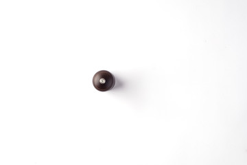 salt/pepper wooden mill on a white background top view