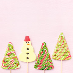 Lollipops sweets. Candy christmas, top view flat lay on pink background. Sweet sucker, lollipop, candy, isolated minimal concept above decoration, food background