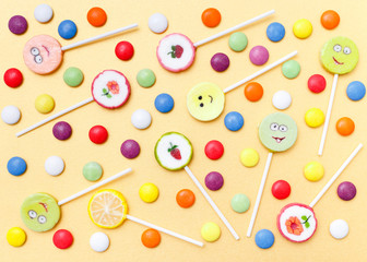 Lollipops sweets. Candy, top view flat lay on yellow background. Sweet sucker, lollipop, candy, isolated minimal concept above decoration, food background - 147164090