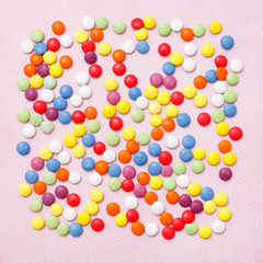 Lollipops sweets. Candy, top view flat lay on pink background. Sweet sucker, lollipop