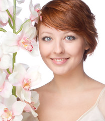 young smiling woman with orchid