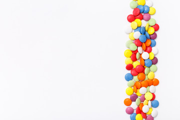 Lollipops sweets. Candy mm, top view flat lay on white background. Sweet sucker, lollipop, candy, isolated minimal concept above decoration, food background