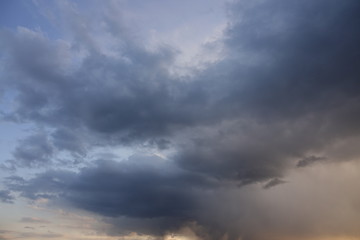 Naklejka na ściany i meble Background of storm clouds before a thunderstorm