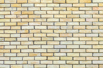 Fototapeta premium Yellow brick wall background