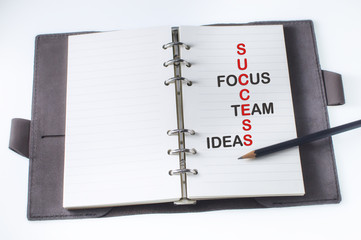 Tool of success words on organizer book with pencil, business concept and success idea