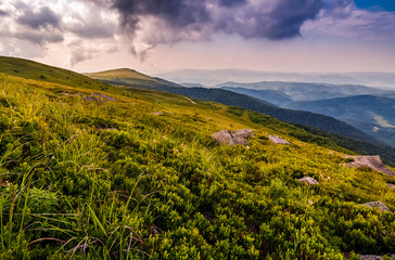 stones on the edge of mountain hillside at sunset