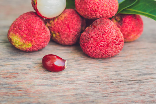 Fresh litchi fruit on an old wooden background