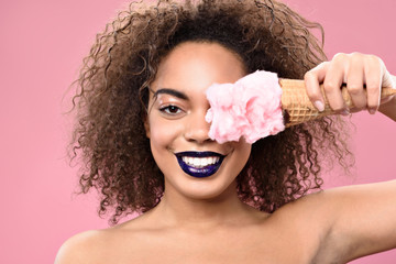 Happy young african female posing with sweetness