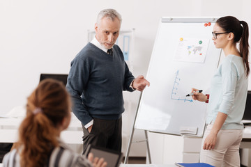 Obraz premium Handsome bearded man keeping his hand in the pocket