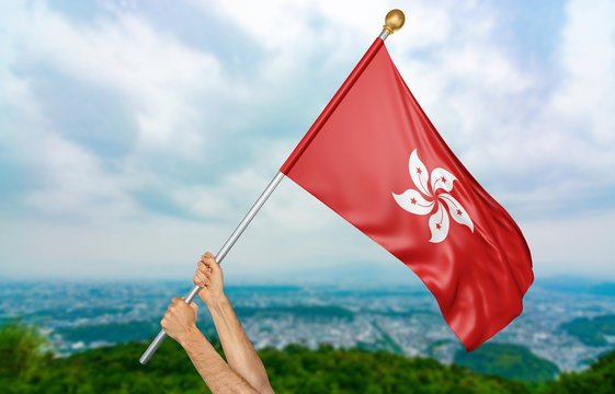 Young man's hands proudly waving the Hong Kong national flag in the sky, part 3D rendering