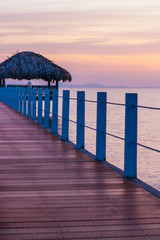Beautiful sunset on a pier near Krong Kampot city in Cambodia