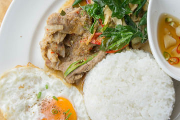 Grilled pork basil with Fried egg , stir basil with crispy pork , Kind of favarite Traditional Thai foods