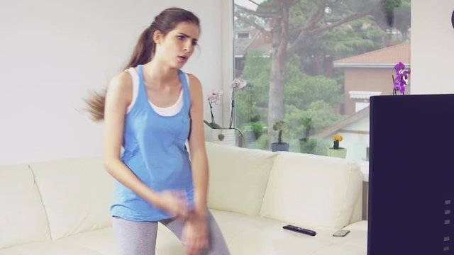 Woman tired stretching watching fitness in tv funny comedy