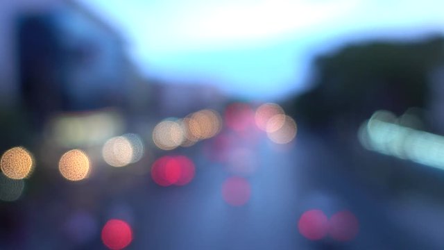 4K Bokeh of car lights. On the street at night Colorful Circles Video Background Loop Glassy circular shapes perform a colorful dance. motion background that is just perfectly suited for DVDs, events