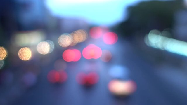 4K Bokeh of car lights. On the street at night Colorful Circles Video Background Loop Glassy circular shapes perform a colorful dance. motion background that is just perfectly suited for DVDs, events