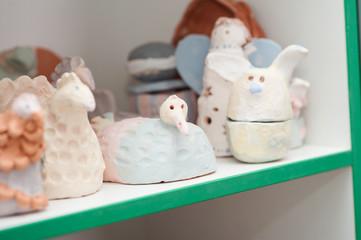 Ceramic products stand on shelves
