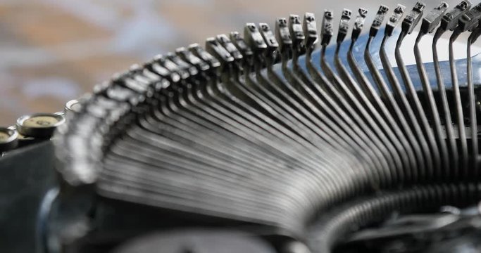 Typing. Metal types in the typewriter. Close-up. Detail.