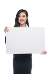 Fototapeta premium Young asian business woman showing a white board isolated on white background.
