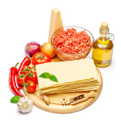 dried uncooked lasagna pasta sheets and vegetables