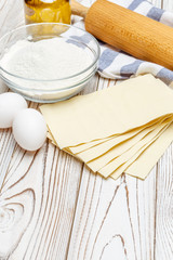 dried uncooked lasagna pasta sheets and ingridients