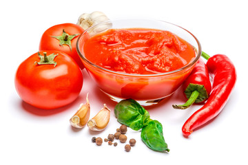 Small glass condiment bowl of red tomato sauce ketchup of peree