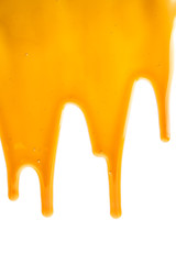 sweet caramel sauce dripping isolated on white background