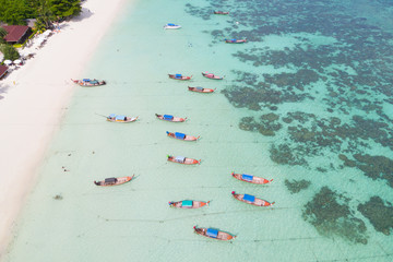 Aerial view over group of long tail boats,Top view from drone, Koh Lipe island, Satun,Thailand