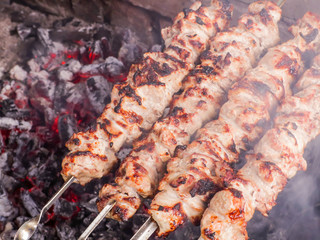 Cooking kebab on the coals. Grilled pork on skewers.