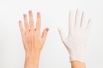 Two female hands in white natural rubber latex glove and without isolated on white background. Horizontal color photography.