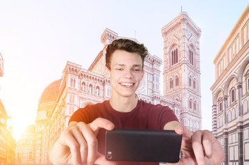 Young tourist taking selfie in front of Florence Cathedral Santa Maria del Fiore at sunrise,...