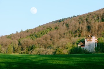Ancient Mariastein Rotberg Castle with full moon, Switzerland