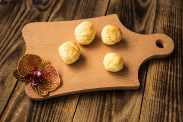 coconut cookies and orchid on wooden board
