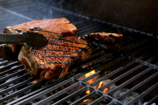 T-Bone Steaks on Barbecue Grill
