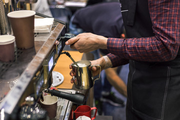 Barista making coffee with coffee machine