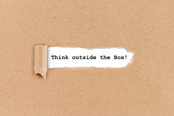 think outside the box hole in paper ripped innovation business concept background / Querdenker loch...