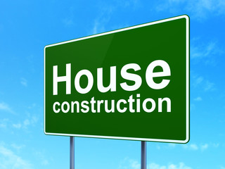 Constructing concept: House Construction on road sign background