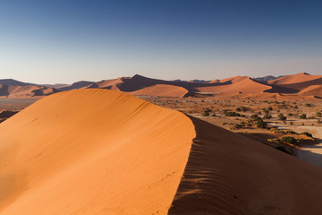 Fototapeta na wymiar View from a peak of a dune at Sossusvlei