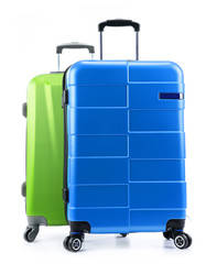 Five plastic suitcases isolated on white