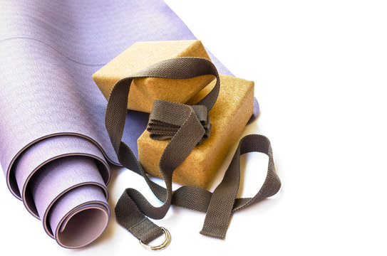 Yoga Accesories: Modern Lilac Mat, Two Cork  Blocks  And Grey Strap On White Isolated Background. Yoga Practice Concept.