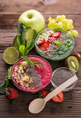 Smoothies in the bowl with fruits and seeds