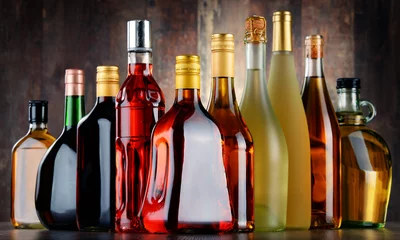 Fotobehang Bottles of assorted alcoholic beverages © monticellllo