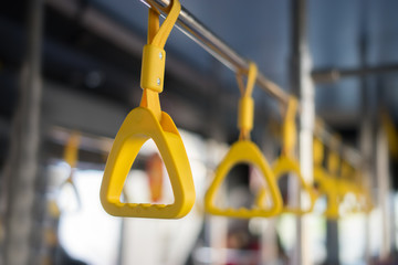 Handle on ceiling of bus, a train, MRT, prevent toppling.underground railway system,vintage color ,copy space