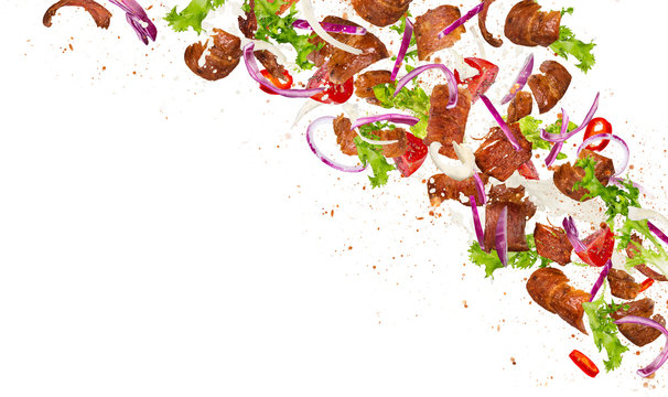 Kebab ingredients flying, close-up.