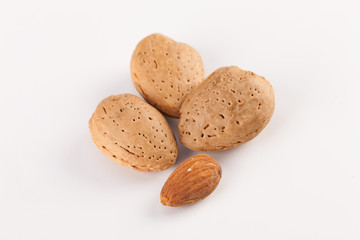 Whole almonds nuts isolated on white background