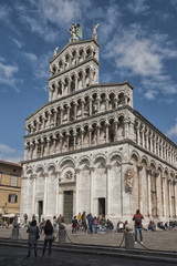 Fototapeta na wymiar 13th century Romanesque facade of the San Michele in Foro, a Roman Catholic basilica church in Lucca, Tuscany, Italy