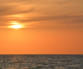A beautiful sunset over the Gulf of Mexico on Indian Rocks Beach, Florida.
