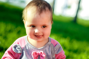 Portreit of baby on green meadow