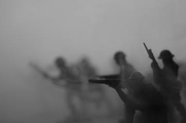 War Concept. Military silhouettes fighting scene on war fog sky background, World War Soldiers...